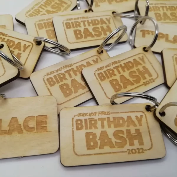 A group of wooden key tags with the keyword "birthday bash.