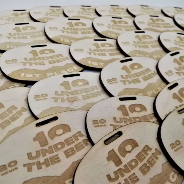 A group of wooden tags with the number 10 on them, commonly used as climbing medals.