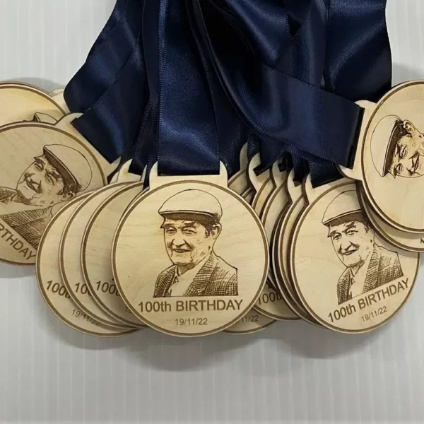 A group of wooden medals with a picture of a man.