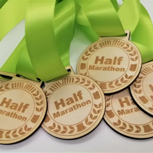 Half marathon medals with green ribbons are perfect for runners.