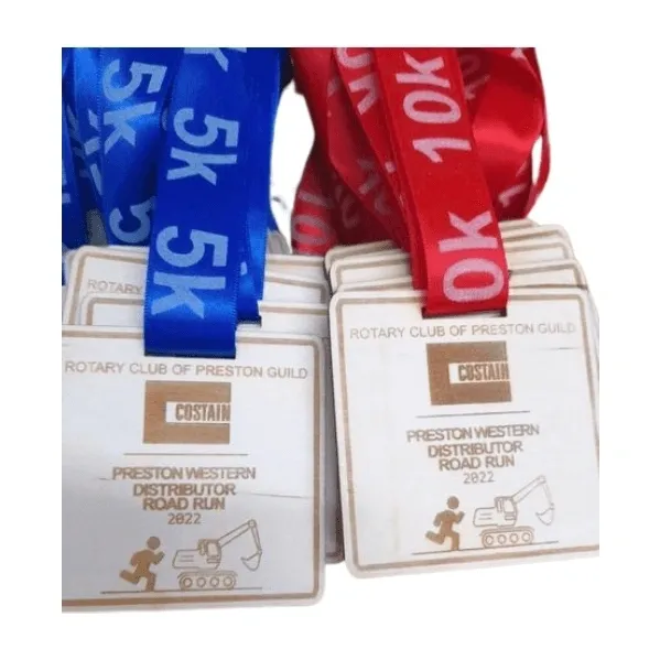 A set of running medals for a 10k race.