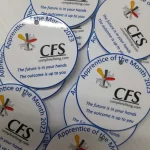 A group of badges with the word cees on them.