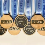 Five wooden medals with the words'survivor' on them.