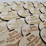 A group of wooden tags with the number 10 on them.