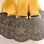 A group of medals with the word randwick wap on them.