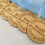 Half marathon medals with blue ribbons.