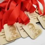 A group of wooden medals with a photo on them.