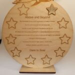 A wooden plaque with the words above and beyond.