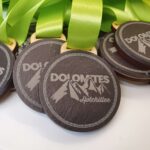 A group of medals with the word dolomites on them.